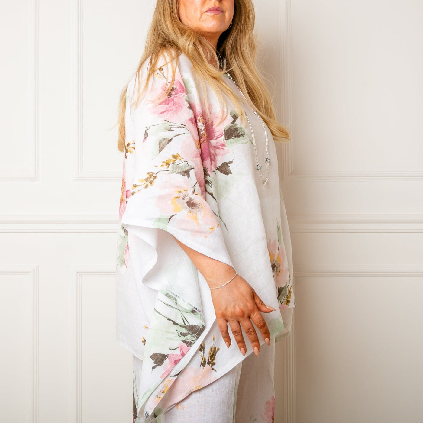 The white Bouquet Print Linen Top with relaxed drop sleeves for an elegant floaty look