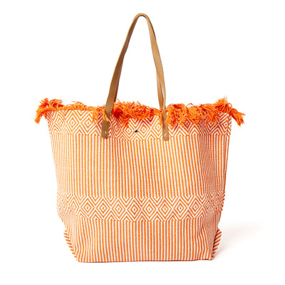 The Woven Beach Bag in orange with a fun aztec and striped pattern, perfect for summer